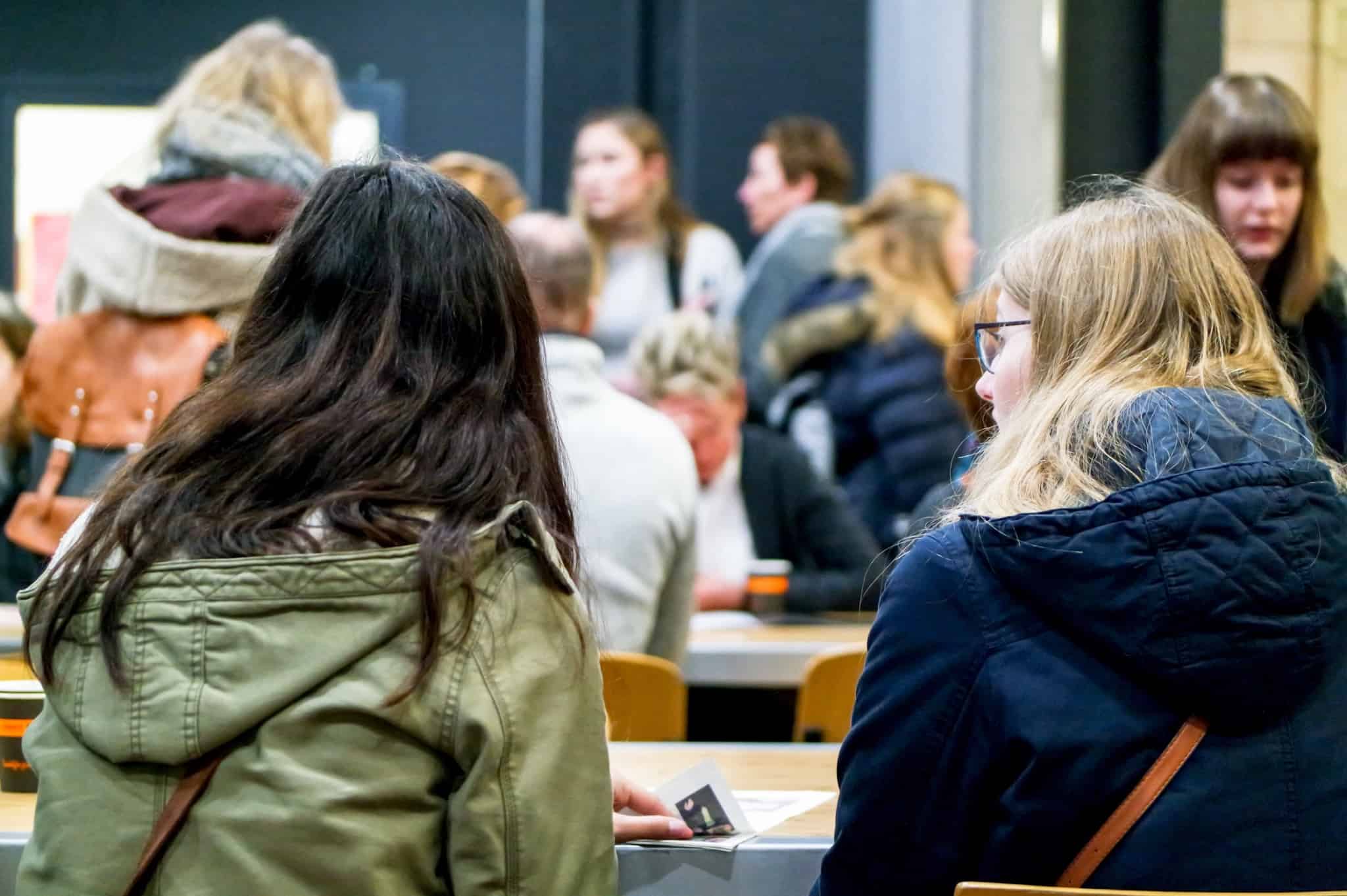 university environment with a vast group of young people talking and socializing